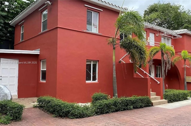 544 NE 62nd St Unit 544-5, Miami, FL 33138 - view of home's exterior featuring stucco siding and a tile roof