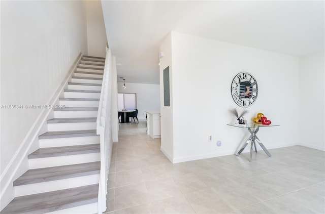 26480 SW 148th Ct Unit 26480, Homestead, FL 33032 - stairs featuring tile patterned floors, electric panel, and baseboards