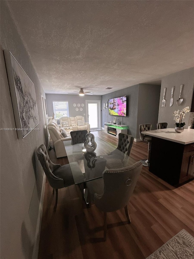 100 NE 171st Ter, Miami, FL 33162 - dining area featuring wood finished floors, a textured ceiling, and ceiling fan