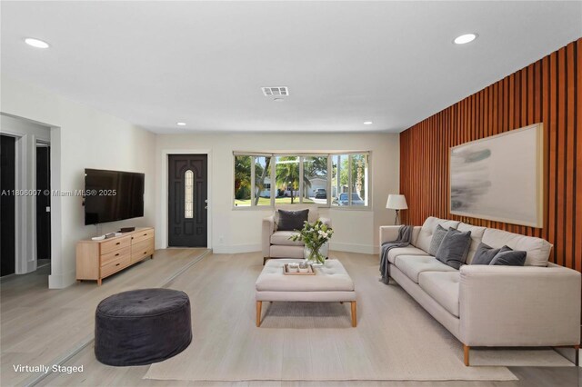 1415 Coolidge St, Hollywood, FL 33020 - living room featuring recessed lighting, wood finished floors, baseboards, and an accent wall