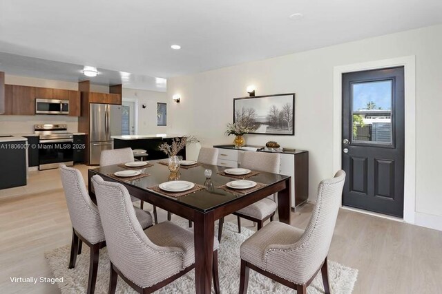 1415 Coolidge St, Hollywood, FL 33020 - dining area with light wood-style flooring
