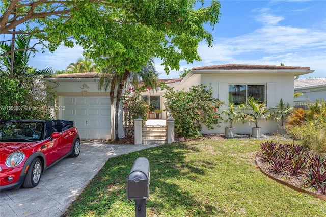 9057 Emerson Ave, Surfside, FL 33154 - view of front facade with an attached garage, driveway, stucco siding, and a front lawn