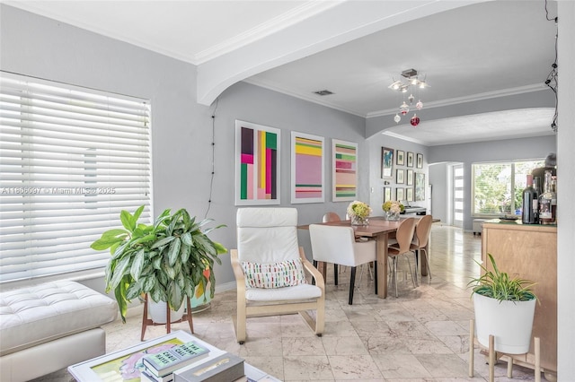 9057 Emerson Ave, Surfside, FL 33154 - living room with ornamental molding, baseboards, and arched walkways