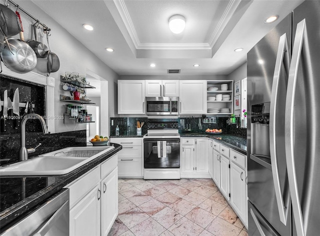 9057 Emerson Ave, Surfside, FL 33154 - kitchen with appliances with stainless steel finishes, a sink, crown molding, open shelves, and a raised ceiling