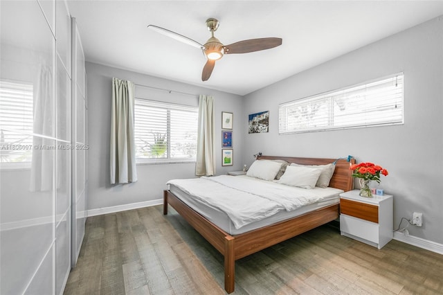 9057 Emerson Ave, Surfside, FL 33154 - bedroom featuring wood finished floors, baseboards, and ceiling fan