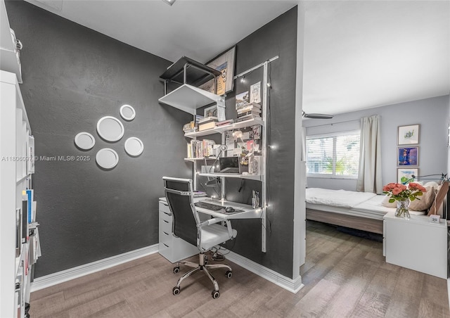 9057 Emerson Ave, Surfside, FL 33154 - home office featuring wood finished floors and baseboards