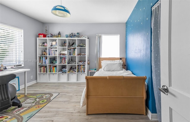 9057 Emerson Ave, Surfside, FL 33154 - bedroom with wood finished floors and baseboards