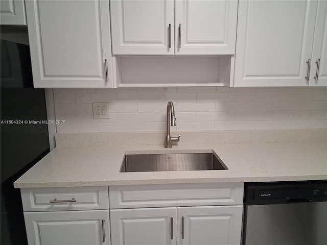 1400 Saint Charles Pl Unit 516, Pembroke Pines, FL 33026 - kitchen with stainless steel dishwasher, open shelves, a sink, and white cabinetry