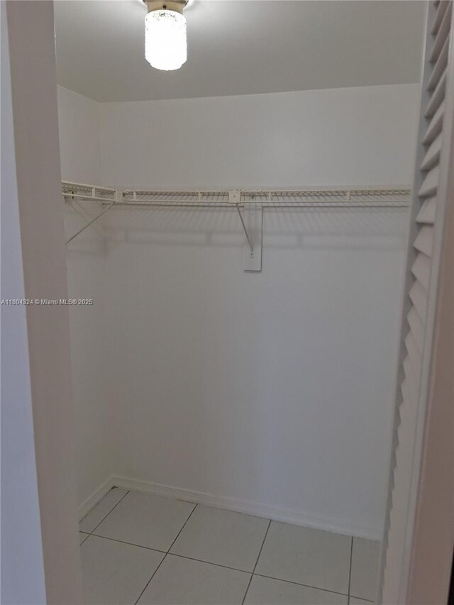 1400 Saint Charles Pl Unit 516, Pembroke Pines, FL 33026 - spacious closet featuring light tile patterned flooring