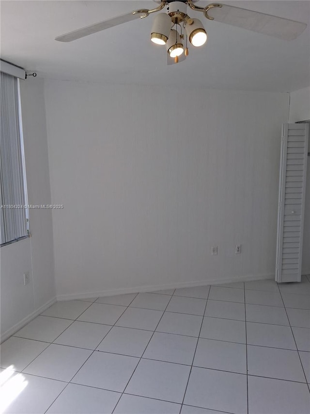 1400 Saint Charles Pl Unit 516, Pembroke Pines, FL 33026 - empty room with a ceiling fan, light tile patterned floors, and baseboards