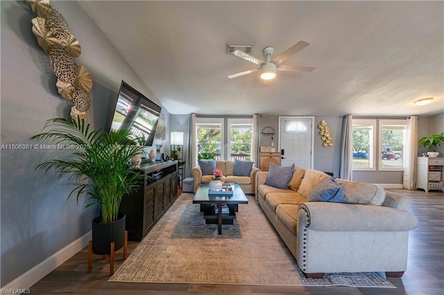 4018 Caloosa Loop, La Belle, FL 33935 - living room featuring ceiling fan, wood finished floors, baseboards, healthy amount of natural light, and lofted ceiling