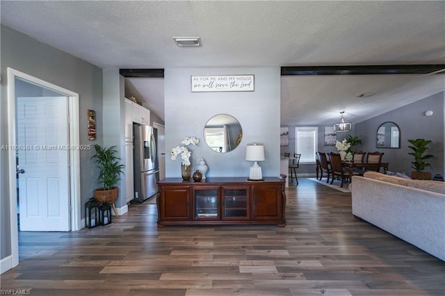 4018 Caloosa Loop, La Belle, FL 33935 - kitchen with stainless steel refrigerator with ice dispenser, dark wood finished floors, a textured ceiling, baseboards, and glass insert cabinets
