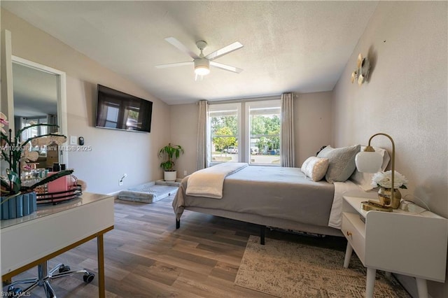 4018 Caloosa Loop, La Belle, FL 33935 - bedroom with multiple windows, wood finished floors, lofted ceiling, and ceiling fan