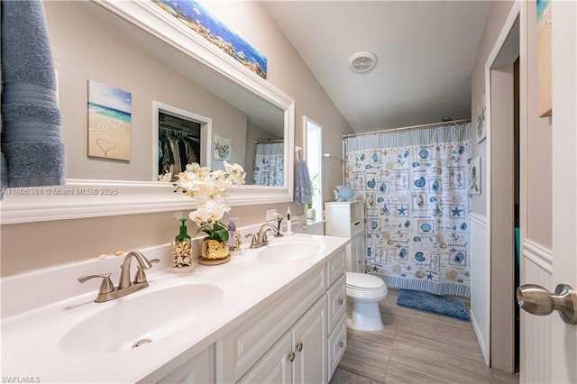 4018 Caloosa Loop, La Belle, FL 33935 - bathroom featuring toilet, a shower with curtain, and double vanity