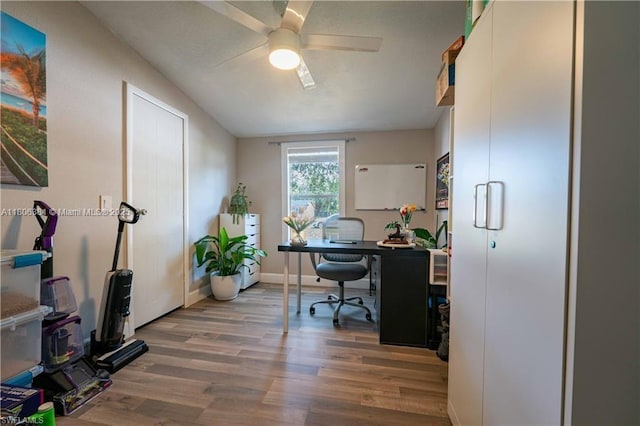 4018 Caloosa Loop, La Belle, FL 33935 - home office with wood finished floors, ceiling fan, and baseboards