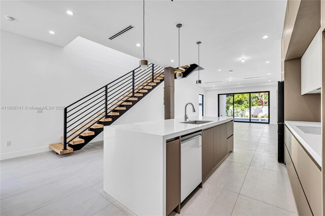 1233 NE 12th Ave Unit B, Fort Lauderdale, FL 33304 - kitchen featuring modern cabinets, dishwasher, light countertops, recessed lighting, and open floor plan