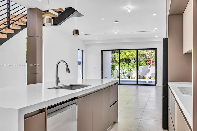 1233 NE 12th Ave Unit B, Fort Lauderdale, FL 33304 - kitchen with stainless steel dishwasher, modern cabinets, recessed lighting, light countertops, and open floor plan