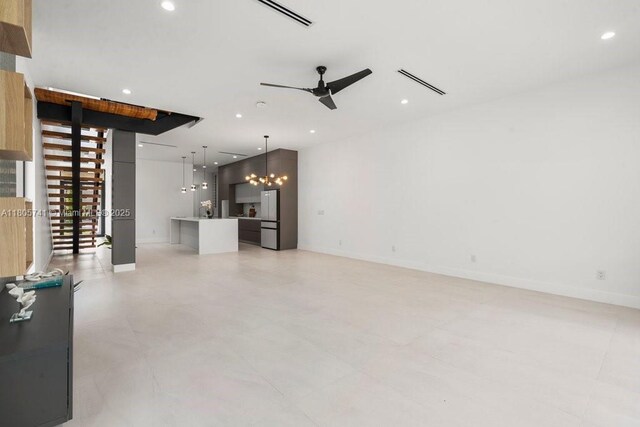 1233 NE 12th Ave Unit B, Fort Lauderdale, FL 33304 - unfurnished living room with a chandelier, recessed lighting, and ceiling fan