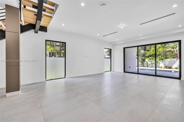 1233 NE 12th Ave Unit B, Fort Lauderdale, FL 33304 - unfurnished room with light tile patterned floors, recessed lighting, and a smoke detector