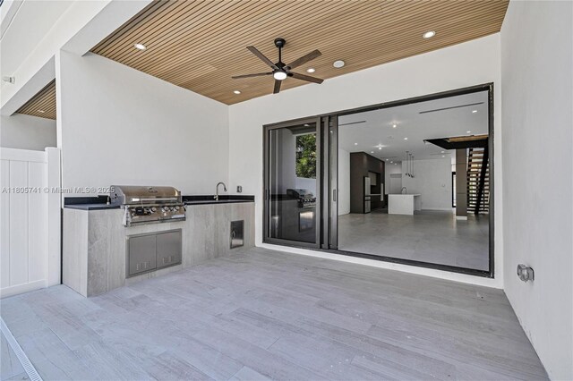 1233 NE 12th Ave Unit B, Fort Lauderdale, FL 33304 - view of patio with a ceiling fan and an outdoor kitchen