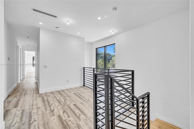 1233 NE 12th Ave Unit B, Fort Lauderdale, FL 33304 - spare room with light wood finished floors, recessed lighting, and a smoke detector