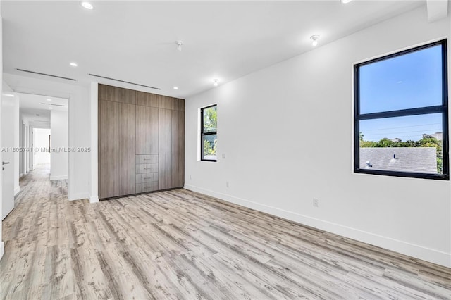 1233 NE 12th Ave Unit B, Fort Lauderdale, FL 33304 - unfurnished bedroom with light wood-style flooring, recessed lighting, and a closet