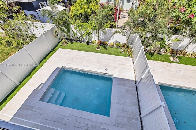 1233 NE 12th Ave Unit B, Fort Lauderdale, FL 33304 - view of swimming pool featuring a fenced backyard