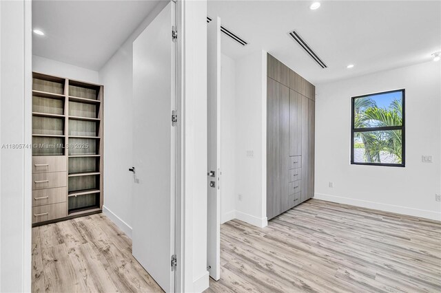 1233 NE 12th Ave Unit B, Fort Lauderdale, FL 33304 - hall featuring light wood-style flooring and recessed lighting