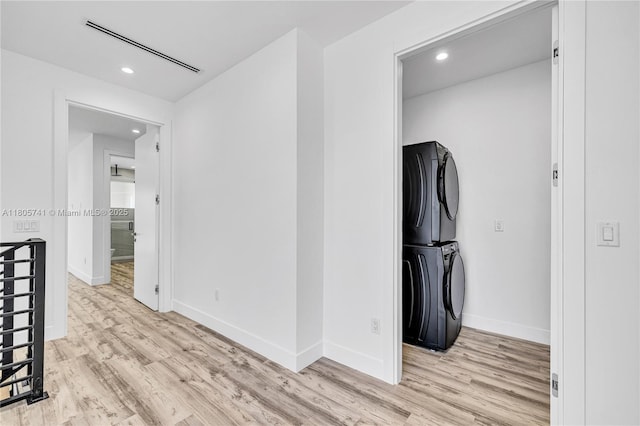 1233 NE 12th Ave Unit B, Fort Lauderdale, FL 33304 - hall with light wood-style flooring, estacked washer and dryer, and recessed lighting