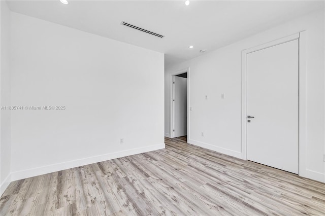 1233 NE 12th Ave Unit B, Fort Lauderdale, FL 33304 - unfurnished bedroom with light wood finished floors and recessed lighting