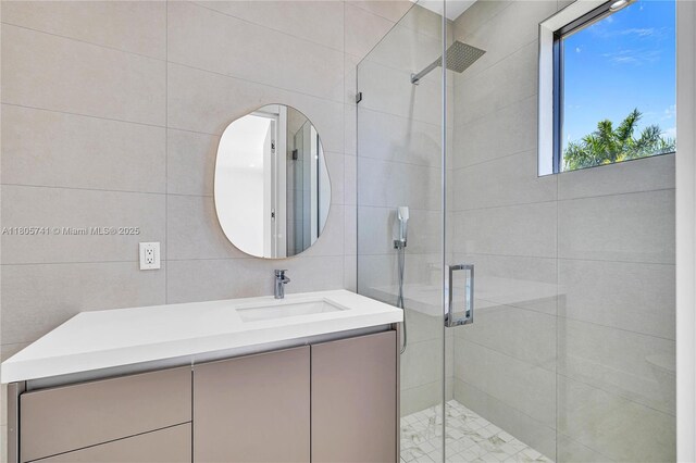 1233 NE 12th Ave Unit B, Fort Lauderdale, FL 33304 - full bathroom featuring vanity, a shower stall, and tile walls