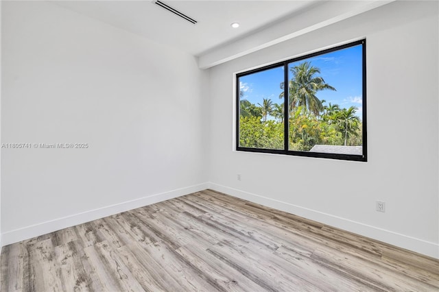 1233 NE 12th Ave Unit B, Fort Lauderdale, FL 33304 - unfurnished room featuring wood finished floors and recessed lighting