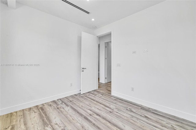 1233 NE 12th Ave Unit B, Fort Lauderdale, FL 33304 - empty room with light wood-style flooring and recessed lighting