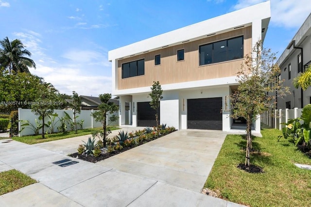 1233 NE 12th Ave Unit B, Fort Lauderdale, FL 33304 - modern home with concrete driveway, a garage, and stucco siding