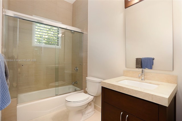 bathroom featuring toilet, vanity, and enclosed tub / shower combo