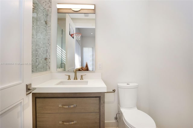 bathroom with toilet and vanity
