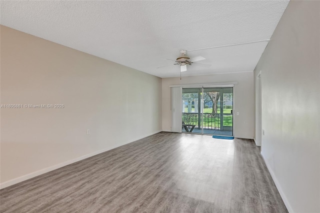 1108 Bahama Bnd Unit B1, Coconut Creek, FL 33066 - empty room featuring wood finished floors, ceiling fan, a textured ceiling, and baseboards