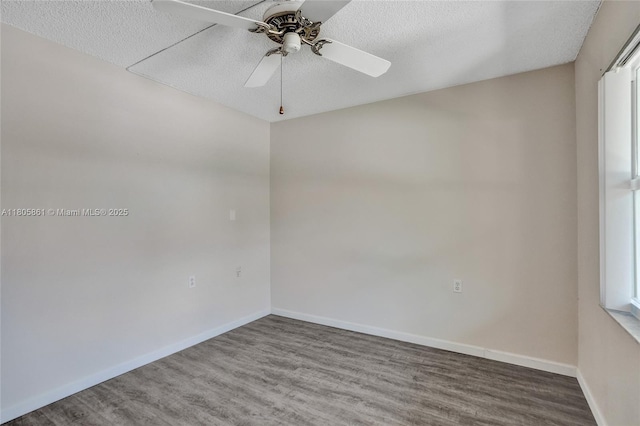 1108 Bahama Bnd Unit B1, Coconut Creek, FL 33066 - unfurnished room with wood finished floors, a textured ceiling, ceiling fan, baseboards, and plenty of natural light