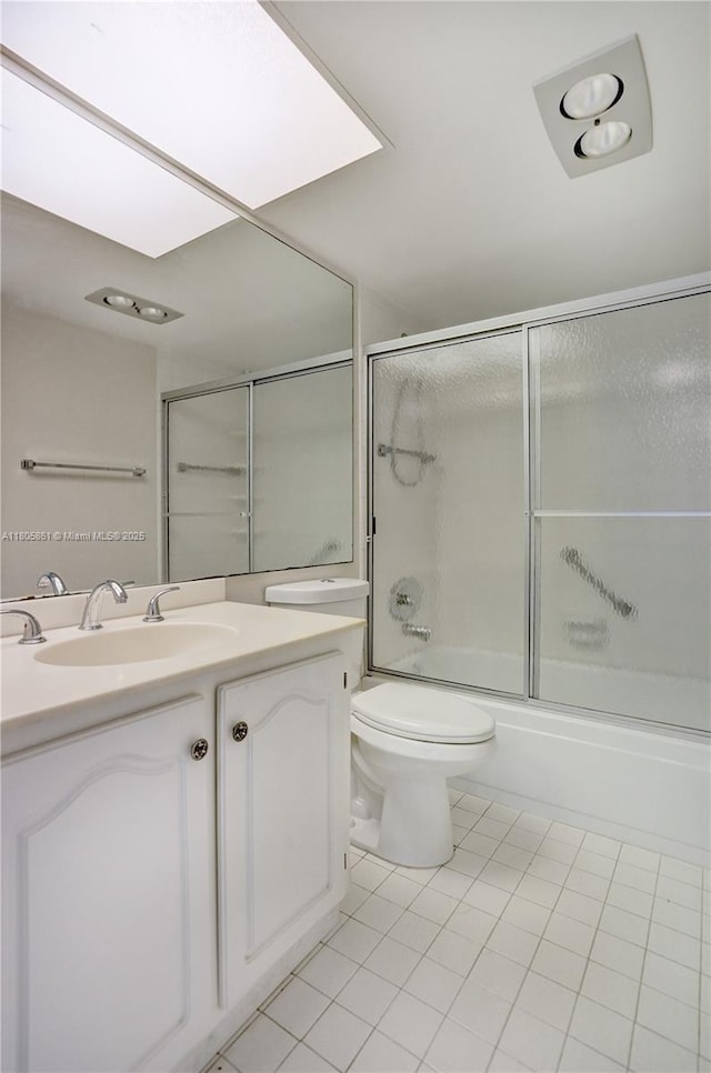 1108 Bahama Bnd Unit B1, Coconut Creek, FL 33066 - bathroom with tile patterned floors, vanity, toilet, and enclosed tub / shower combo