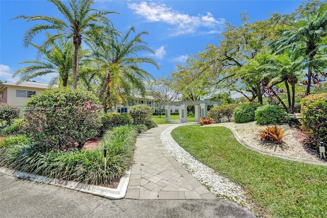 1108 Bahama Bnd Unit B1, Coconut Creek, FL 33066 - surrounding community with a pergola and a lawn