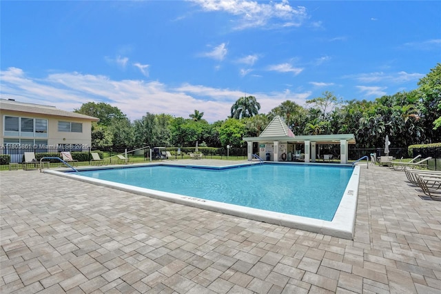 1108 Bahama Bnd Unit B1, Coconut Creek, FL 33066 - community pool with a patio and view of scattered trees