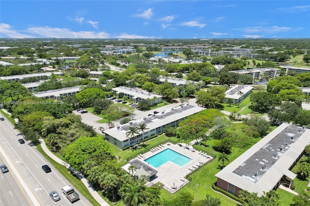 1108 Bahama Bnd Unit B1, Coconut Creek, FL 33066 - aerial view of a pool area and a tree filled landscape