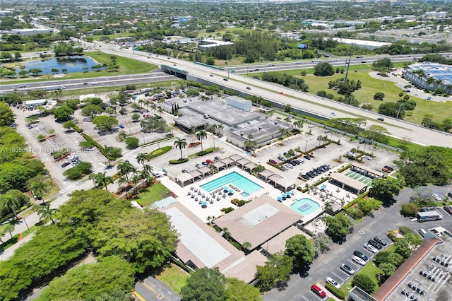 1108 Bahama Bnd Unit B1, Coconut Creek, FL 33066 - aerial view of a pool, a major roadway, and a large body of water
