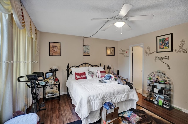 4222 Inverrary Blvd Unit 4213, Lauderhill, FL 33319 - bedroom with wood finished floors, baseboards, ceiling fan, and a textured ceiling