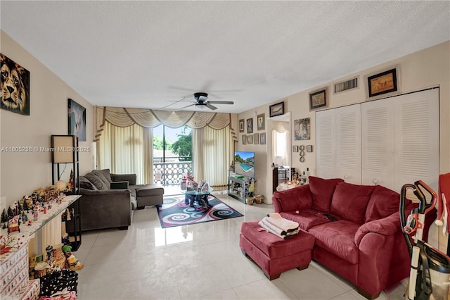 4222 Inverrary Blvd Unit 4213, Lauderhill, FL 33319 - living room with a ceiling fan, a textured ceiling, and tile patterned floors