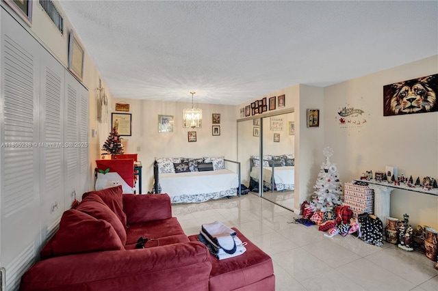 4222 Inverrary Blvd Unit 4213, Lauderhill, FL 33319 - living area featuring a chandelier, a textured ceiling, and light tile patterned floors