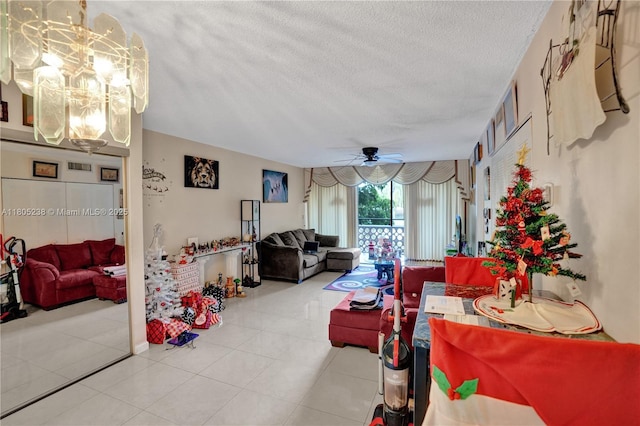 4222 Inverrary Blvd Unit 4213, Lauderhill, FL 33319 - living room featuring a chandelier, a textured ceiling, ceiling fan, and light tile patterned floors