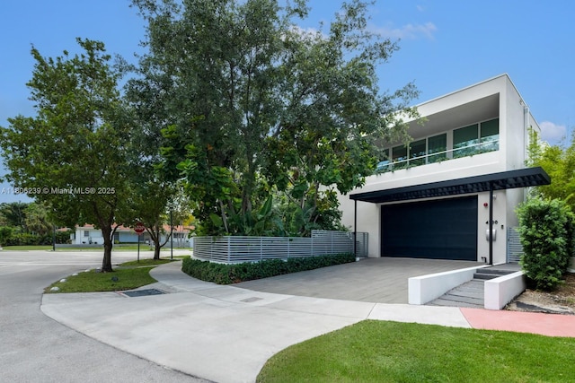 4700 N Meridian Ave, Miami Beach, FL 33140 - view of front facade featuring an attached garage, driveway, and stucco siding
