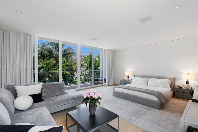 4700 N Meridian Ave, Miami Beach, FL 33140 - bedroom featuring floor to ceiling windows and wood finished floors
