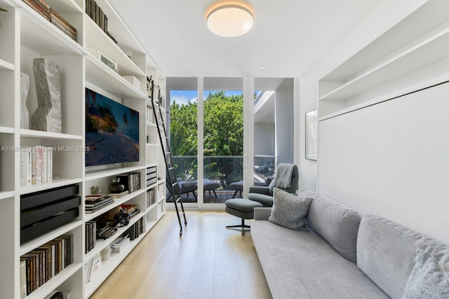 4700 N Meridian Ave, Miami Beach, FL 33140 - living room featuring wood finished floors and expansive windows